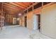 Interior view of a rustic barn featuring wood beams, stalls, and a dirt floor at 512 County Road 136, Elizabeth, CO 80107