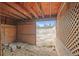 Rustic barn interior with open space and a view of the surrounding fields and trees at 512 County Road 136, Elizabeth, CO 80107