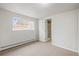 Bedroom featuring an ensuite bathroom and ample light at 512 County Road 136, Elizabeth, CO 80107