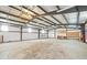 Large garage space with high ceilings and ample room for storage and projects at 512 County Road 136, Elizabeth, CO 80107