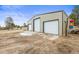 Metal building featuring three garages at 512 County Road 136, Elizabeth, CO 80107