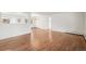 Bright living room featuring hardwood floors and ample natural light from large windows at 512 County Road 136, Elizabeth, CO 80107