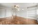 Spacious main bedroom featuring hardwood floors, ample closet space, and neutral decor at 512 County Road 136, Elizabeth, CO 80107