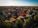 Aerial view showcases the neighborhood setting and mature trees at 529 Uinta Way, Denver, CO 80230