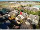 Aerial view showcasing a home's location near Lowry Sundial & Great Lawn Park, highlighting neighborhood amenities at 529 Uinta Way, Denver, CO 80230