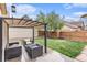 Backyard patio with comfortable outdoor seating and mature landscaping, creating a private oasis at 529 Uinta Way, Denver, CO 80230