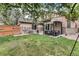 Beautiful backyard with patio, pergola, lush green grass, offering a perfect outdoor living space at 529 Uinta Way, Denver, CO 80230