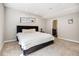 Comfortable bedroom with plush carpeting, neutral paint, and a doorway leading to en-suite bathroom at 529 Uinta Way, Denver, CO 80230