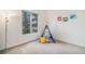 bedroom with a teepee and colorful wall art, featuring a large window at 529 Uinta Way, Denver, CO 80230