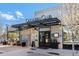 The Officers Club restaurant with outdoor seating and signage on the exterior of the building at 529 Uinta Way, Denver, CO 80230