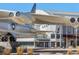 The Wings Over the Rockies Air & Space Museum exterior with a large plane, flags and landscaping at 529 Uinta Way, Denver, CO 80230