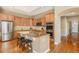 Eat-in kitchen featuring granite countertops, stainless steel appliances, a center island, and ample cabinet space at 529 Uinta Way, Denver, CO 80230