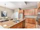 Kitchen with granite countertops, stainless steel appliances, and an island with seating at 529 Uinta Way, Denver, CO 80230