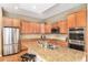 Spacious kitchen with granite countertops, stainless steel appliances, and plenty of cabinet storage space at 529 Uinta Way, Denver, CO 80230