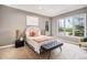 Serene bedroom with a neutral color palette, carpet floors, and a large window at 529 Uinta Way, Denver, CO 80230