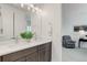 Bathroom features double sinks with quartz countertops and modern fixtures and lighting at 39405 Stockton Cir, Elizabeth, CO 80107