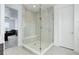 Bathroom featuring a glass shower with a built-in bench and a door to the bedroom at 39405 Stockton Cir, Elizabeth, CO 80107