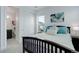 Bedroom with a large window, access to a bathroom, and a spacious closet at 39405 Stockton Cir, Elizabeth, CO 80107