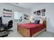 Bright bedroom features a wooden bed frame, sports decor, and a dedicated desk space at 39405 Stockton Cir, Elizabeth, CO 80107