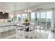 Bright dining area adjacent to kitchen features a sliding glass door leading to the outdoor area at 39405 Stockton Cir, Elizabeth, CO 80107