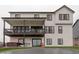 Back of home featuring large covered patio, hot tub, trampoline and fenced yard at 39405 Stockton Cir, Elizabeth, CO 80107