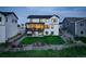 Stunning home exterior with a well-maintained yard, a spacious patio, and a charming backyard with a trampoline at 39405 Stockton Cir, Elizabeth, CO 80107
