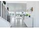 Bright foyer featuring hardwood floors, and view of dining and living spaces at 39405 Stockton Cir, Elizabeth, CO 80107
