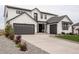 Charming two-story home featuring a two-car garage and a one-car garage at 39405 Stockton Cir, Elizabeth, CO 80107