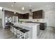 Modern kitchen with a large island, stainless steel appliances, and sleek cabinetry at 39405 Stockton Cir, Elizabeth, CO 80107