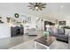 Bright living room with open floor plan, leading to kitchen and staircase at 39405 Stockton Cir, Elizabeth, CO 80107