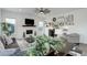 Comfortable living room with fireplace, TV, stylish decor, and gray sofa at 39405 Stockton Cir, Elizabeth, CO 80107