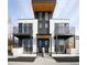 Modern two-unit building with white brick and black accents at 2312 S Delaware St # 2, Denver, CO 80223