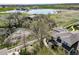Stunning aerial view overlooking a community lake, landscaping, and the home at 3000 E 112Th Ave # 56, Northglenn, CO 80233