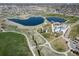 Community aerial view showcasing scenic lakes, green spaces, playground, and walking trails, perfect for outdoor activities at 3000 E 112Th Ave # 56, Northglenn, CO 80233