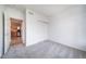 A bright bedroom with carpet and a closet at 3000 E 112Th Ave # 56, Northglenn, CO 80233