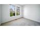 Cozy bedroom with natural light, neutral carpet, and a calming outdoor view at 3000 E 112Th Ave # 56, Northglenn, CO 80233