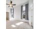 Bright bedroom with natural light, neutral carpet, and an en-suite bathroom at 3000 E 112Th Ave # 56, Northglenn, CO 80233