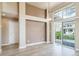 Dining room with large windows offering backyard views and contemporary light fixture at 3000 E 112Th Ave # 56, Northglenn, CO 80233