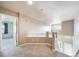 Hallway with stair railing and doors leading to other rooms of the home at 3000 E 112Th Ave # 56, Northglenn, CO 80233