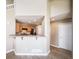 Bright kitchen features warm wood cabinets, modern appliances and a breakfast bar at 3000 E 112Th Ave # 56, Northglenn, CO 80233