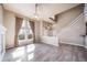 Bright living room boasts large windows, natural light, and a modern ceiling fan at 3000 E 112Th Ave # 56, Northglenn, CO 80233