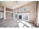 Bright living room featuring a fireplace, ample natural light, and a sliding glass door at 3000 E 112Th Ave # 56, Northglenn, CO 80233