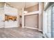 Open-concept living room featuring wood floors and sliding glass door at 3000 E 112Th Ave # 56, Northglenn, CO 80233