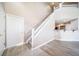 Inviting living room features vaulted ceilings, wood floors, and a staircase to the second floor at 3000 E 112Th Ave # 56, Northglenn, CO 80233
