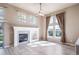 Cozy living room features a fireplace and an abundance of natural light from many windows at 3000 E 112Th Ave # 56, Northglenn, CO 80233