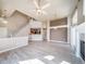 Bright living room with open concept, fireplace, and a view of the upstairs loft at 3000 E 112Th Ave # 56, Northglenn, CO 80233
