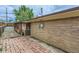 The backyard showcases a brick patio, wooden fence, and house exterior, blending seamlessly together at 7995 Robin Ln, Denver, CO 80221