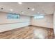 Finished basement with recessed lighting and wood-look flooring at 7995 Robin Ln, Denver, CO 80221