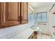 Bathroom featuring a vanity with cabinets, a sink, and a well-lit mirror at 7995 Robin Ln, Denver, CO 80221