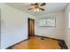 Bedroom boasts hardwood floors, a ceiling fan and a convenient closet at 7995 Robin Ln, Denver, CO 80221